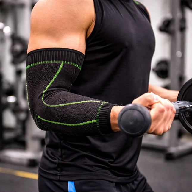 Person wearing a black arm sleeve with green accents in a gym setting