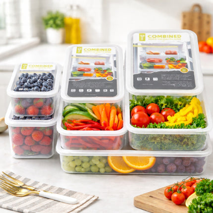 Set of food storage containers with fresh produce on a kitchen counter.