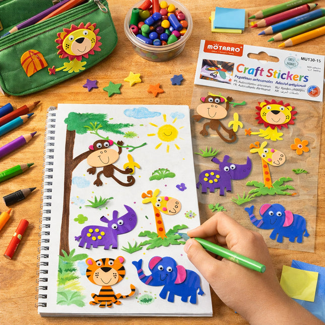 Child coloring with craft stickers on a wooden table