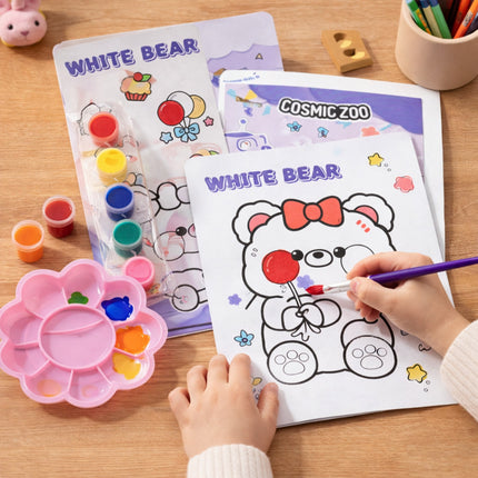 Child coloring a white bear with a red bow from a 'Cosmic Zoo' coloring book on a wooden table.