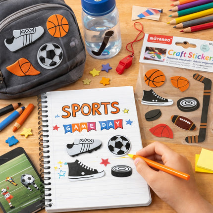 Children's desk with a notebook titled 'Sports Game Day', craft stickers, and stationery items.