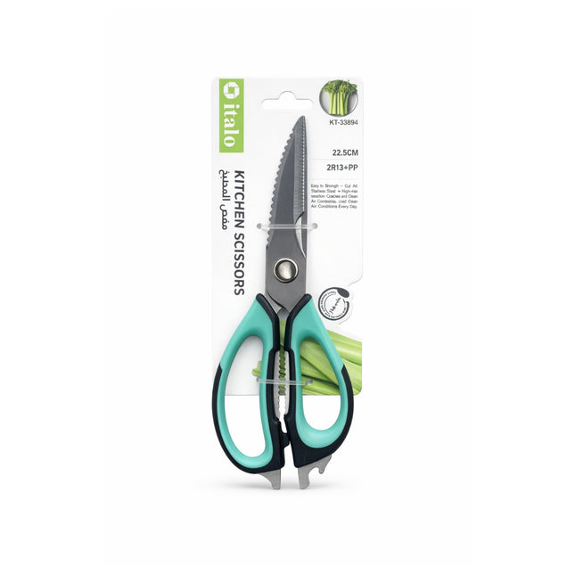 Kitchen scissors with green handles on a white background