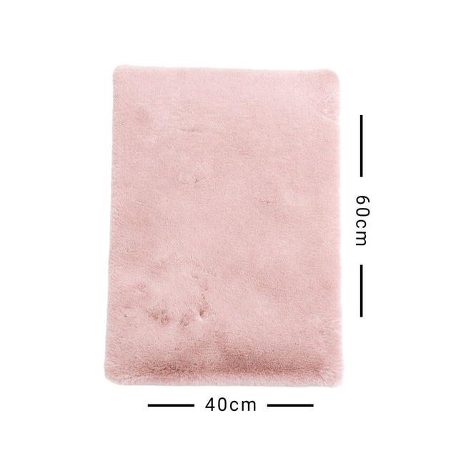 Pink rectangular rug with dimensions 40cm x 60cm on a white background