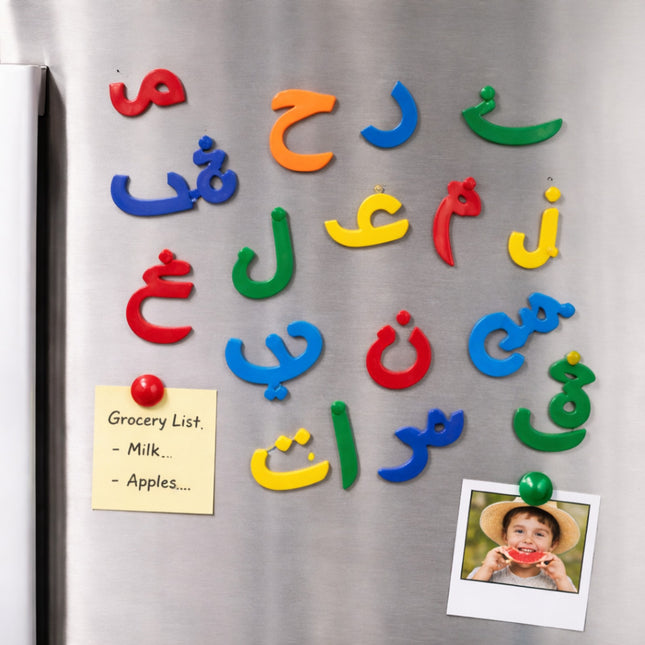 Colorful magnetic letters on a refrigerator with a grocery list and photo attached