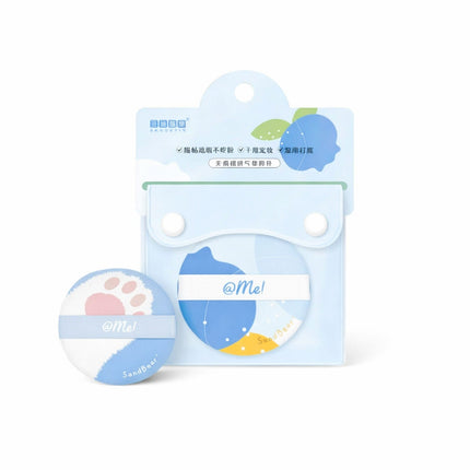 Round product with paw print design on a blue background, featuring the brand 'Me!' on a white card.