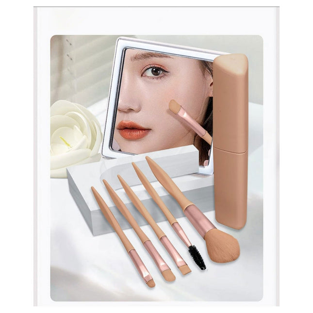 Makeup brushes and a mirror with a rose on a white background