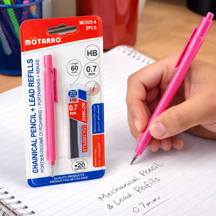 Pink mechanical pencil with Motarro refills packaging on a desk.
