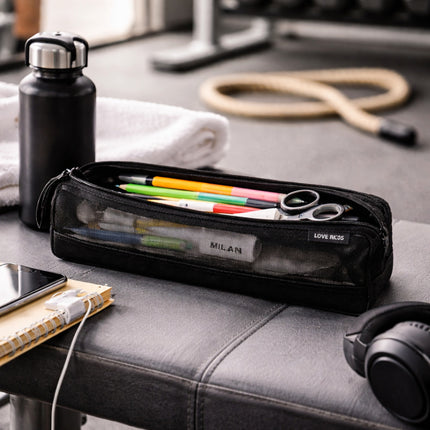 Black pencil case with stationery items on a desk next to a water bottle and phone.