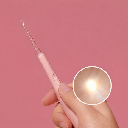 Pink ear cleaning tool held by a hand with a close-up inset on a pink background