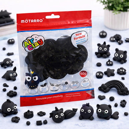 Mоторро Air Clay packaging with black clay and molded shapes on a white surface.