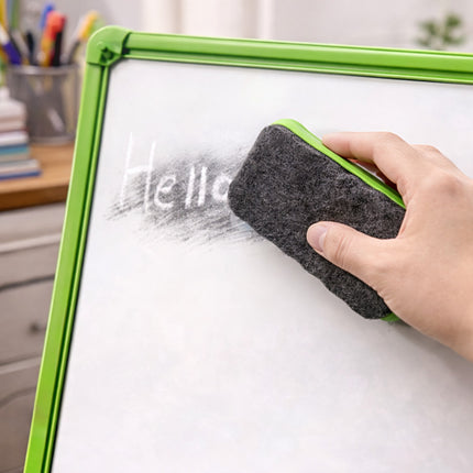 Hand using a black eraser to erase the word 'Hello' from a whiteboard.