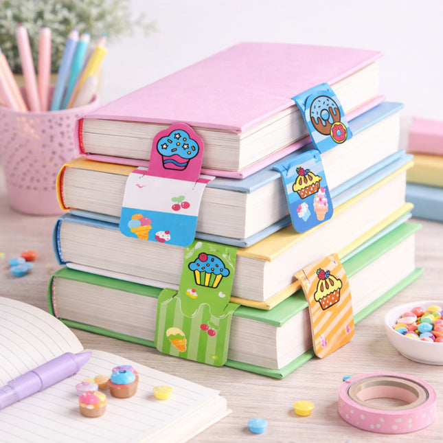 Stack of colorful books with decorative bookmarks on a desk with stationery items.