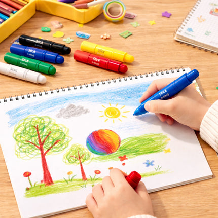 Child drawing a colorful landscape with markers on a wooden table.