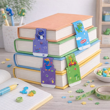 Stack of books with colorful dinosaur-themed bookmarks on a desk with stationery items.