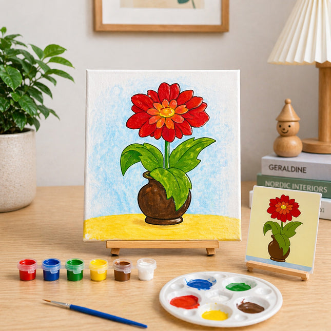 Painting of a red flower in a vase on an easel with art supplies on a table.