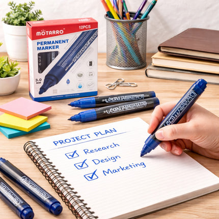 Motarro permanent markers with a project plan on paper, office supplies in the background