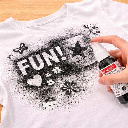 White t-shirt with black designs and text, being sprayed with a bottle labeled 'Rotofaco'.