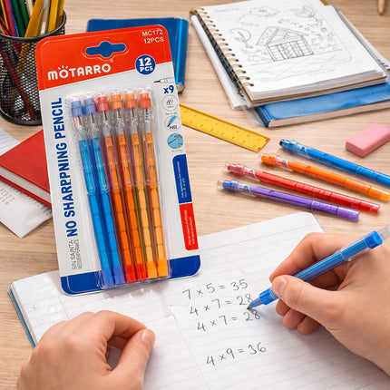 Colorful no-sharpening pencils with packaging on a desk with stationery items.