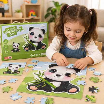 Child playing with a panda-themed puzzle set on a table, with a Bigjigs Puzzle Day box in the background.