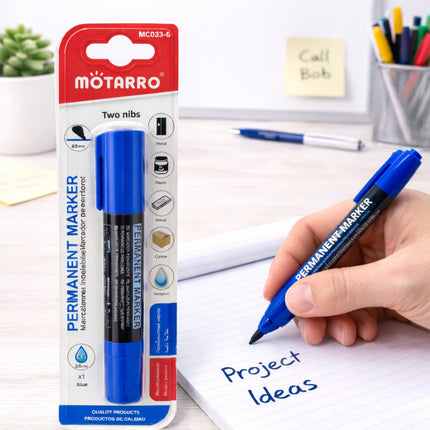 Blue permanent marker with Motarro packaging, held by a hand writing 'Project Ideas' on paper.