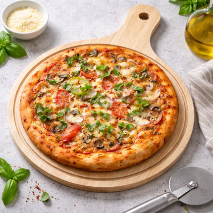 Pizza on a wooden board with basil leaves and olive oil on a light gray background