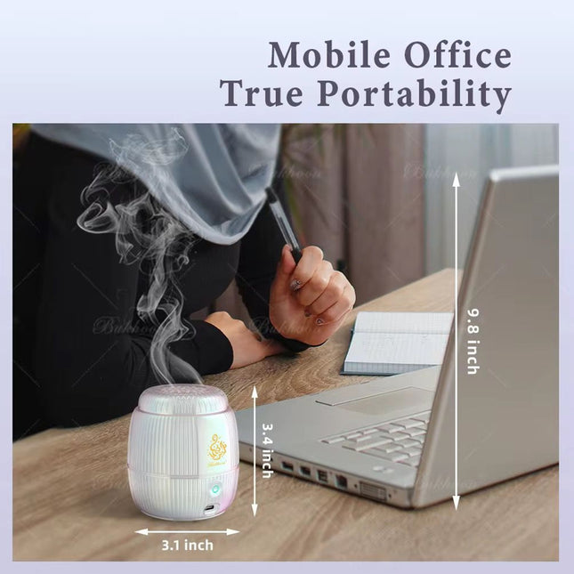 A small portable desktop humidifier shown on a desk next to a laptop, with a person seated behind it. The image includes text reading 'Mobile Office True Portability' and dimension arrows indicating the humidifier is 3.