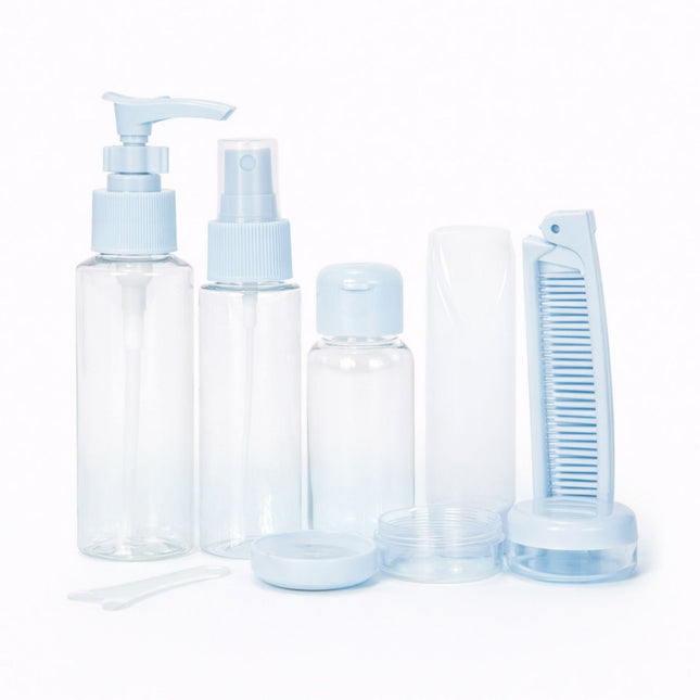 Set of clear plastic bottles with blue caps and accessories on a white background