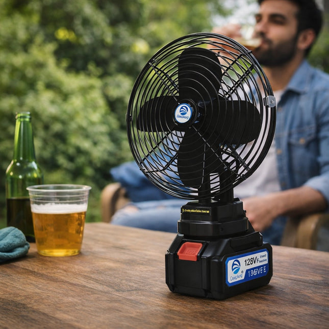 Portable fan on a table with a man drinking beer in the background