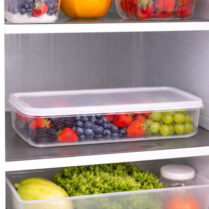 Fridge shelves with containers of fruits and vegetables