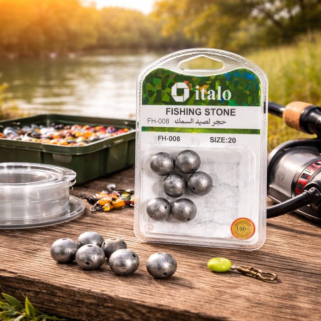 Packaged fishing stones with italo branding on a wooden surface near a lake.