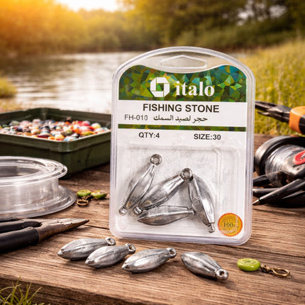 Packaged fishing stones with italo branding on a wooden surface near a lake.