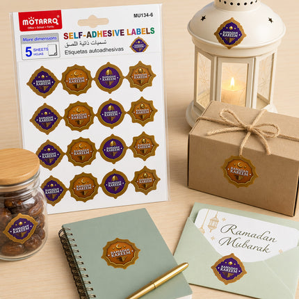 Moterarq self-adhesive labels with Ramadan Kareem design on a table with lantern, gift box, and jar.
