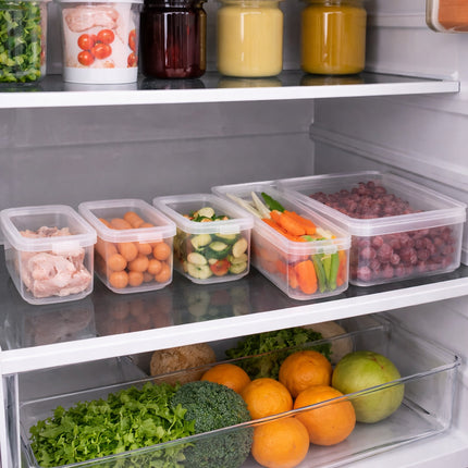 Open refrigerator with various food items in containers on shelves