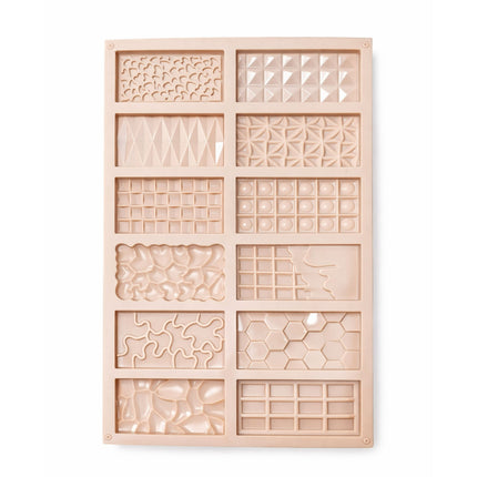 Wooden mold with geometric patterns on a white background