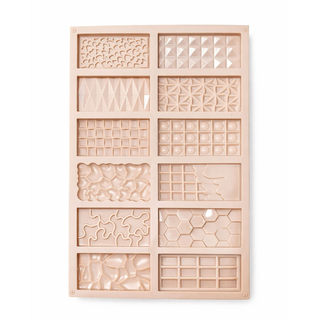 Wooden mold with geometric patterns on a white background