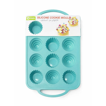 Turquoise silicone cookie mold with packaging on a white background