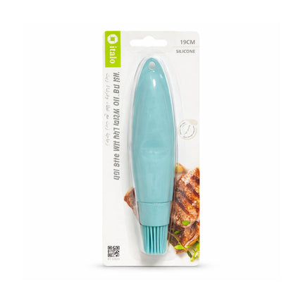 Turquoise silicone brush in packaging with brand logo on a white background