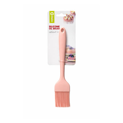 Pink silicone oil brush with packaging on a white background