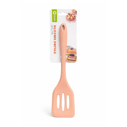 Peach-colored spatula with packaging on a white background