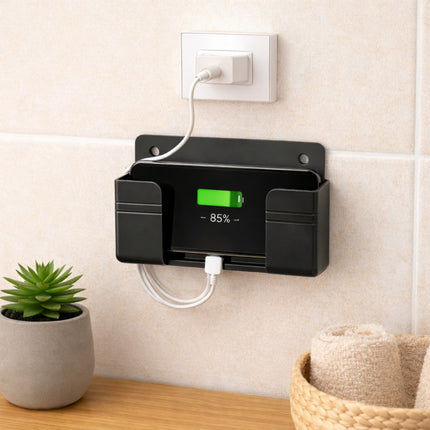 Black wall-mounted charging station with digital display on a light-colored wall.