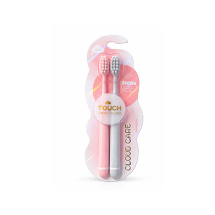Two toothbrushes in a pink and white packaging with 'Touch' branding on a white background.