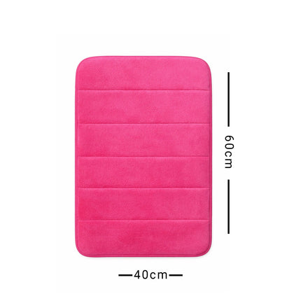 Pink bath mat with dimensions on a white background