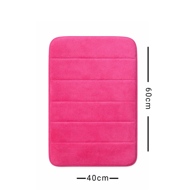 Pink bath mat with dimensions on a white background