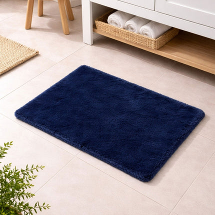Navy blue rug on a light wooden floor with a white cabinet and basket in the background.