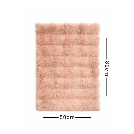 Pink fluffy rug with dimensions on a white background