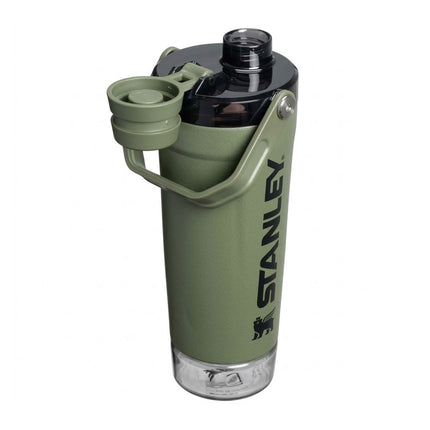 Green Stanley water bottle with a clear lid on a white background