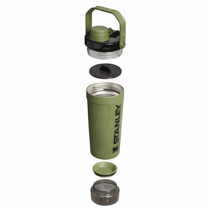 Green Stanley insulated mug with various components on a white background
