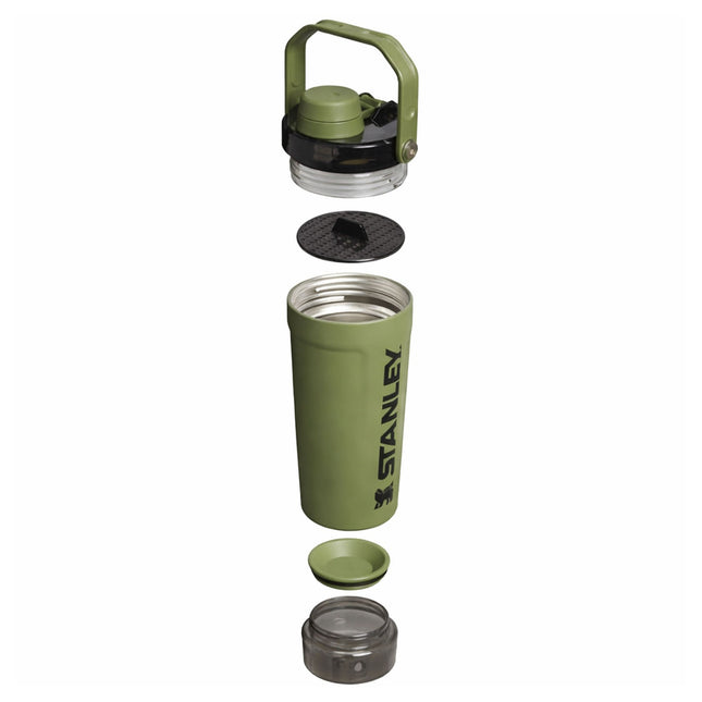 Green Stanley insulated mug with various components on a white background