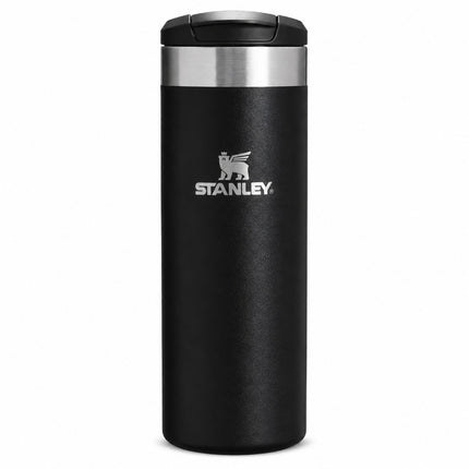 A black Stanley travel tumbler with a stainless steel band near the lid and the silver Stanley logo on the front, shown on a plain white background.