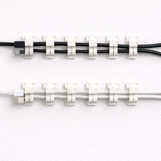 Cable ties holding two cables together on a white background